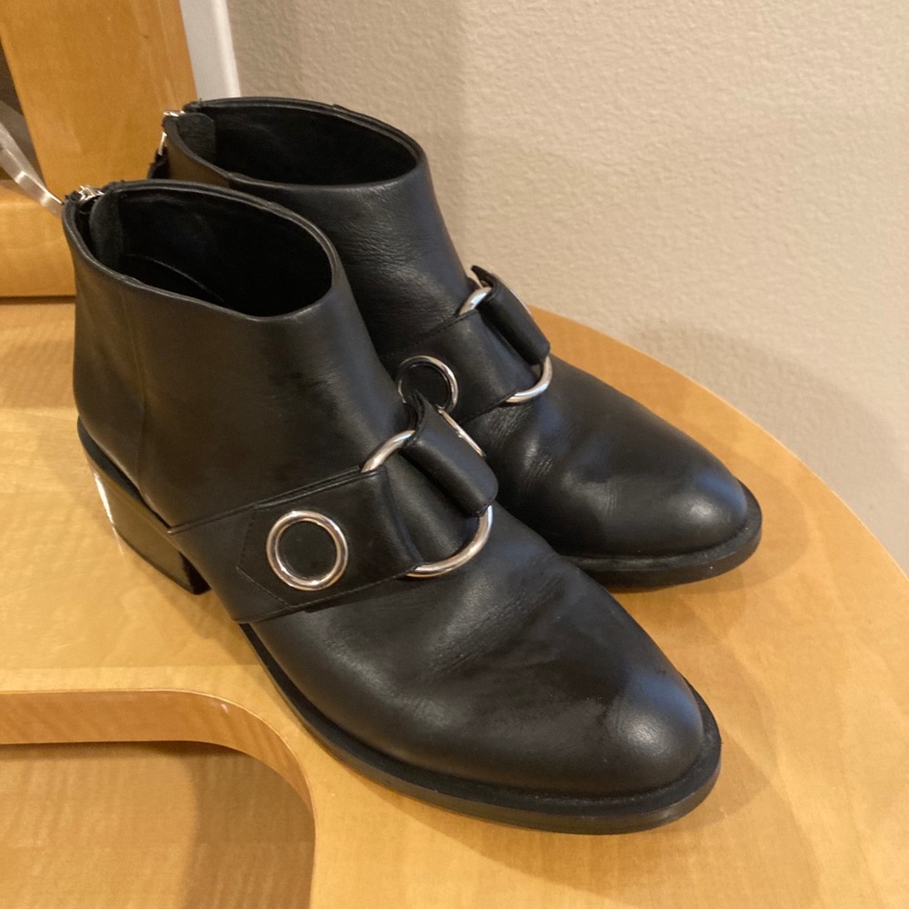 Emanuel black leather boots